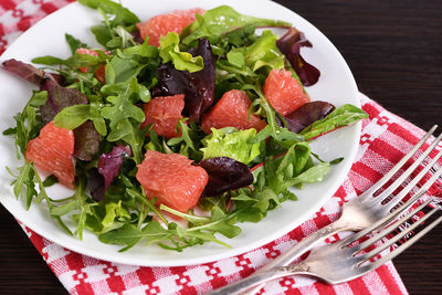 Grapefruit salad, a mix of lettuce, arugula and olive dressing. dietary menu 