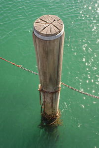 High angle view of boat tied on lake