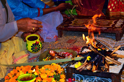 Midsection of man preparing food