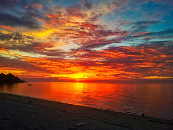 Scenic view of sea against orange sky