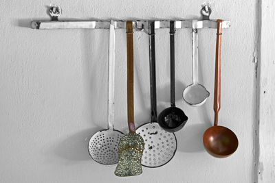Close-up of kitchen utensils hanging