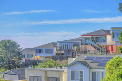 Buildings in city against sky