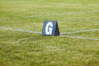 A goal line marker ready for practice at marching band rehearsal