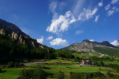 Scenic view of mountains against cloudy sky