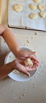 High angle view of hand holding ice cream