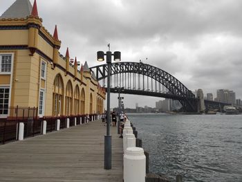 View of bridge over river in city
