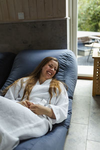 High angle view of woman relaxing on bean bag