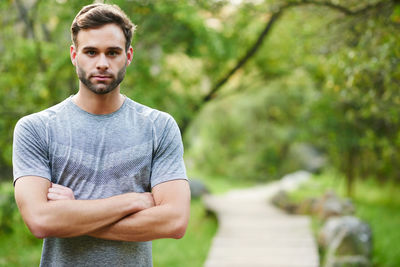 Portrait of young man standing outdoors