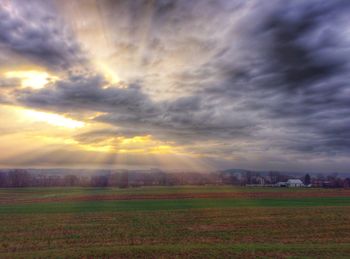 Scenic view of landscape against cloudy sky
