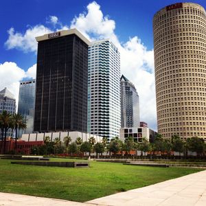 Buildings against cloudy sky