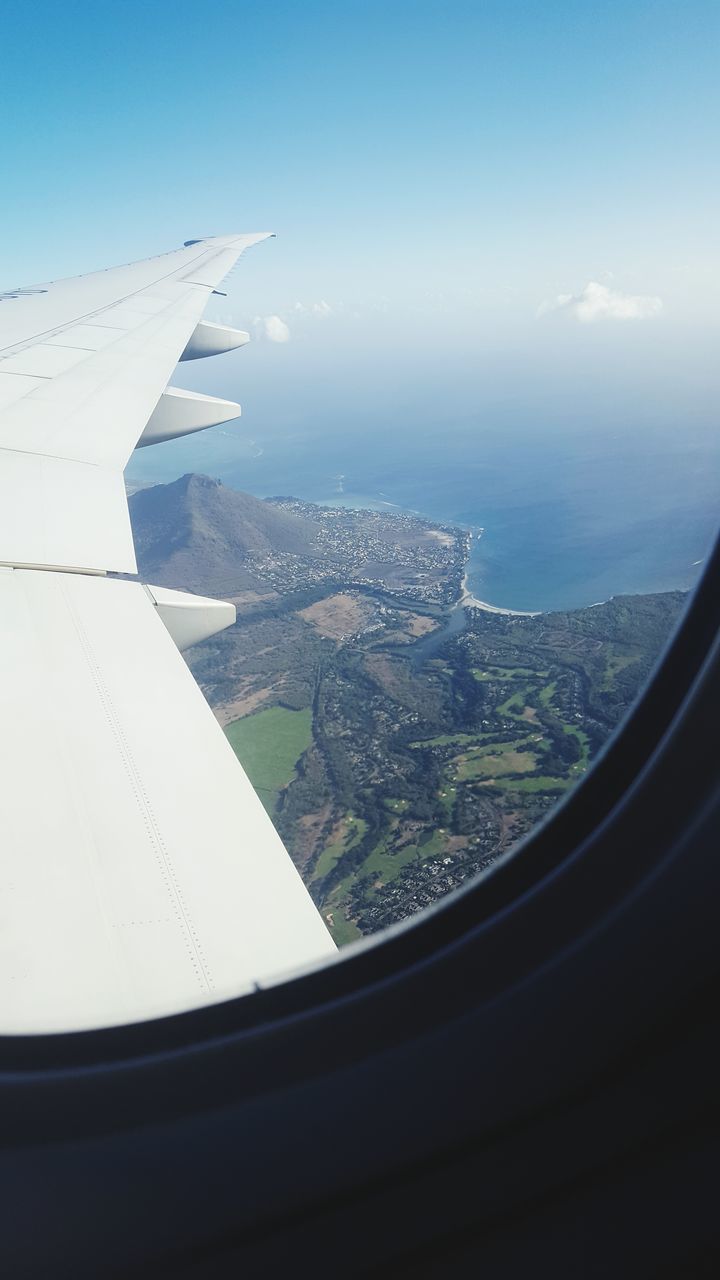 aerial view, flying, cityscape, aircraft wing, city, mode of transport, sky, part of, cropped, journey, day, landscape, no people, cloud - sky, nature, cloud, blue