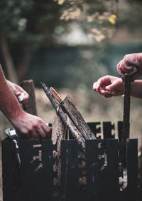 Close-up of hands working on wood