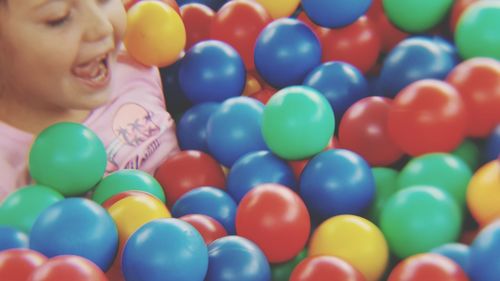 Full frame shot of boy with multi colored balls