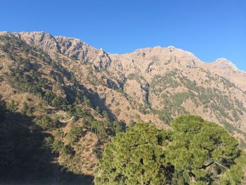 Scenic view of mountain against clear blue sky