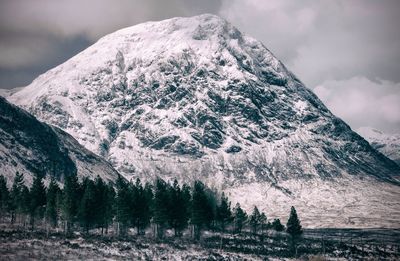 Scenic view of mountains against sky during winter