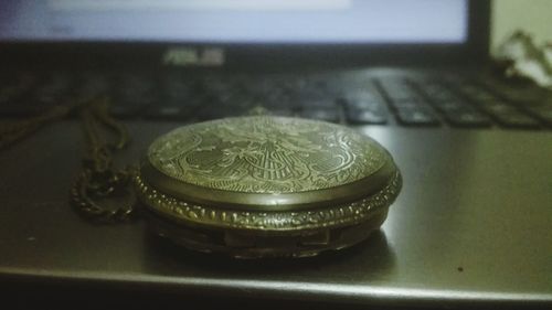 Close-up of coins on table