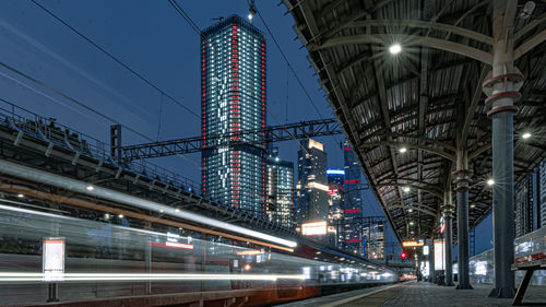 Low angle view of illuminated buildings in city at night