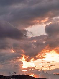 Low angle view of cloudy sky during sunset