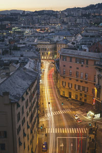 High angle view of traffic on street amidst buildings in city