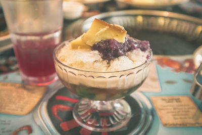 Close-up of ice cream in glass on table