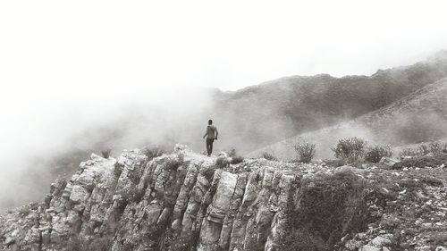 Scenic view of mountains in foggy weather