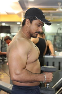 Midsection of shirtless man