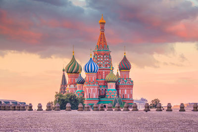 Traditional building against sky during sunset