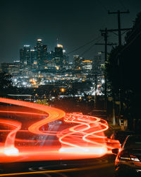 Light trails on street in city at night