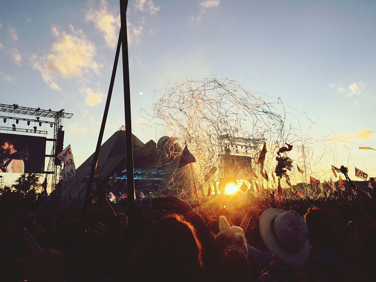 sky, large group of people, sunset, lifestyles, crowd, leisure activity, silhouette, men, person, celebration, enjoyment, cloud - sky, fun, outdoors, arts culture and entertainment, event, togetherness, sun, cloud