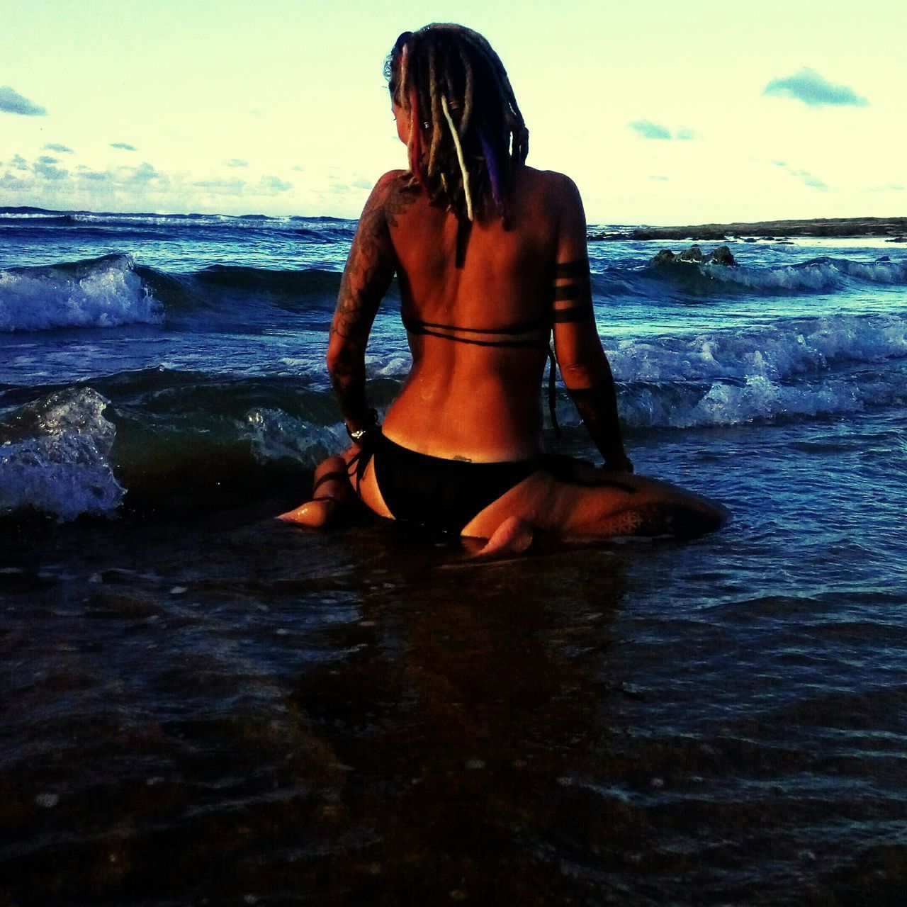 YOUNG WOMAN AT BEACH