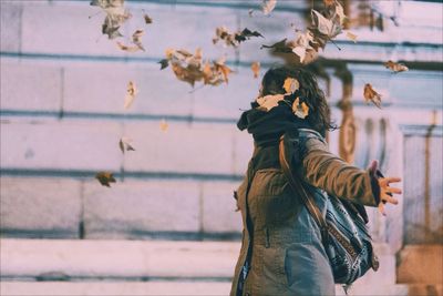 Man standing on railing