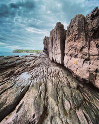 Rock formations on mountain against sky