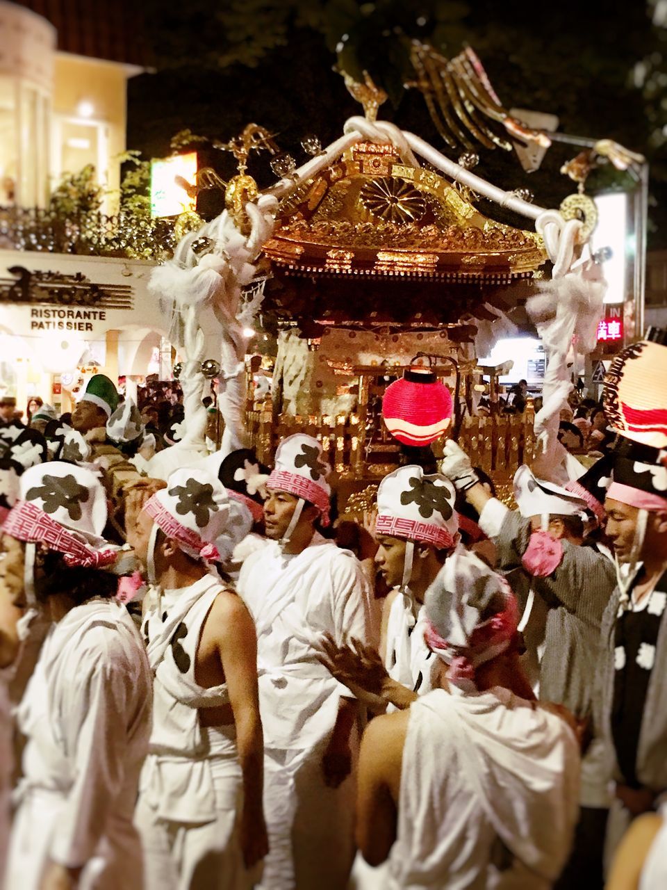 large group of people, religion, crowd, celebration, tradition, spirituality, cultures, person, men, place of worship, arts culture and entertainment, illuminated, night, market, temple - building, traditional festival, event, leisure activity