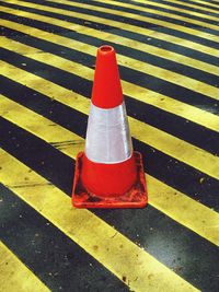 High angle view of traffic cone on zebra crossing