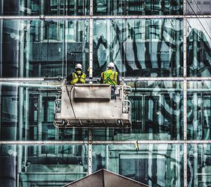 People working in front of building