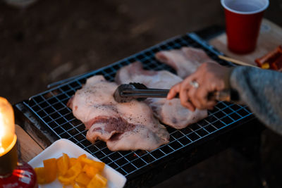 High angle view of meat on barbecue grill