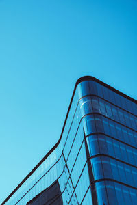 Modern office block against blue sky