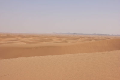 Scenic view of desert against clear sky