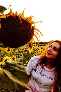 Portrait of beautiful woman against blue sky