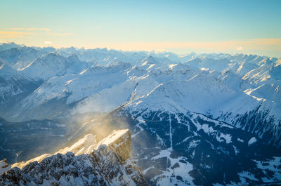 High angle view of snowcapped mountains against sky