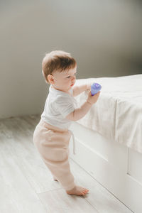 Portrait of cute girl playing with teddy bear