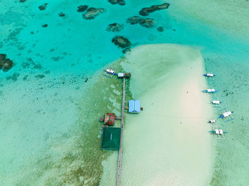 Aerial drone of atoll with tropical island and beach. onok island, balabac, philippines.