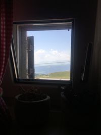 View of sea through window