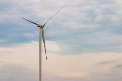 Low angle view of wind turbine against sky