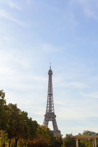 Tower against cloudy sky