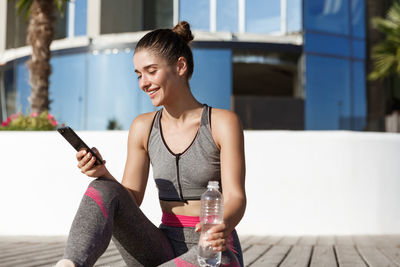 Young woman using mobile phone