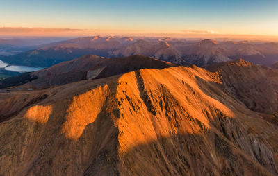 Scenic view of mountains against sky during sunset