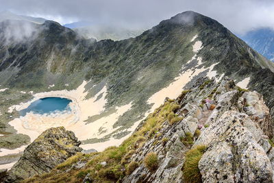 Aerial view of mountain range against sky