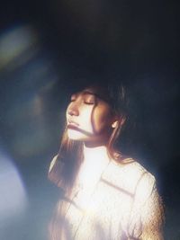 Portrait of young woman looking away