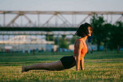 Side view of woman on field